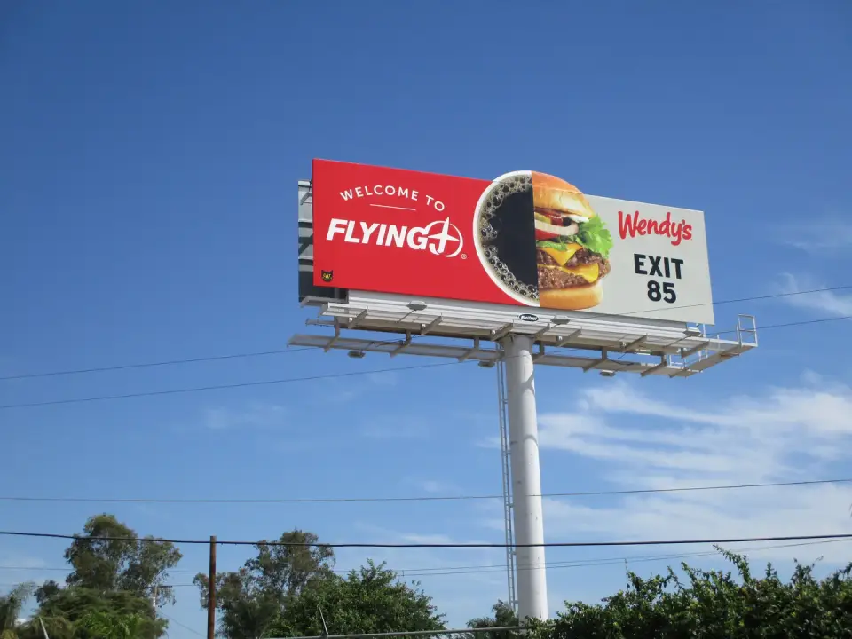 Wendy’s and Flying J exit billboard on a white monopole in Goshen