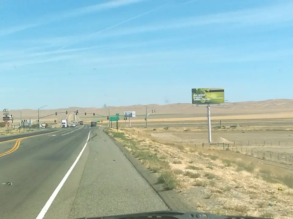 Harris Ranch billboard along a rural highway