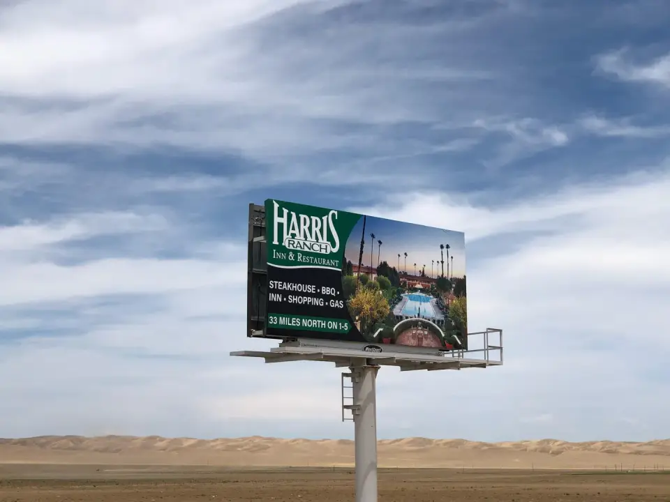 Close view of a Harris Ranch roadside billboard