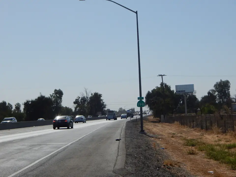 Roadway approach view of a billboard near Highway 198