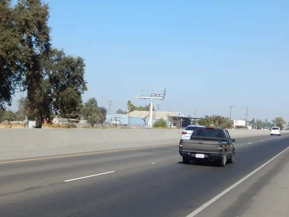 Blank billboard visible from Highway 43 under a clear sky