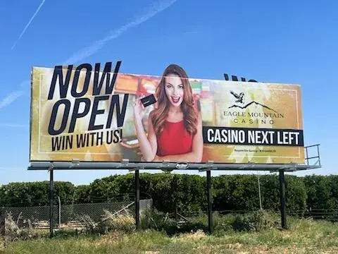 Eagle Mountain Casino billboard in a citrus orchard near Porterville