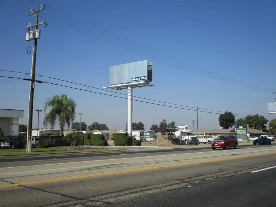 Blank silver billboard beside a Route 42 bus stop on Mooney Boulevard
