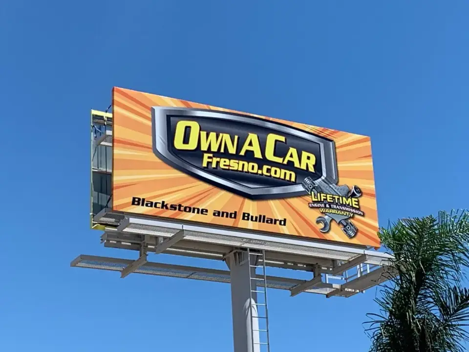 Own A Car Fresno billboard near the Hanford roundabout